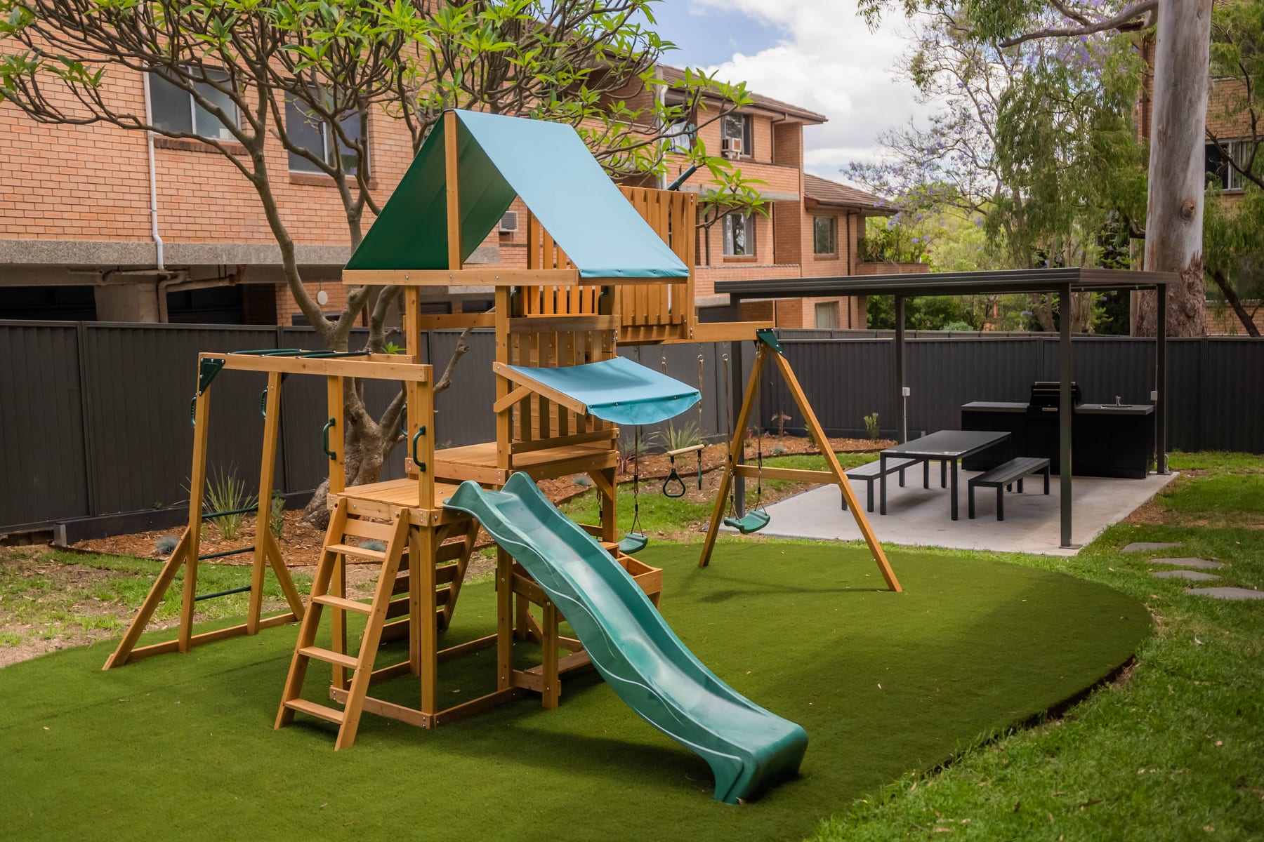 Courtyard landscaping, play area on synthetic turf