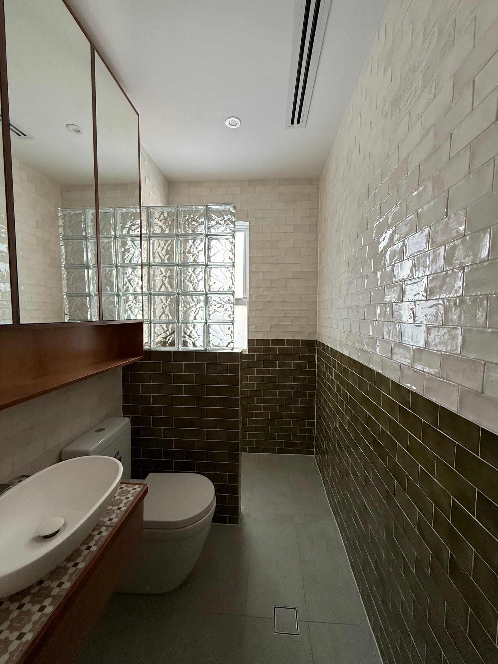 Heritage bathroom after renovation — finished tiling and fittings