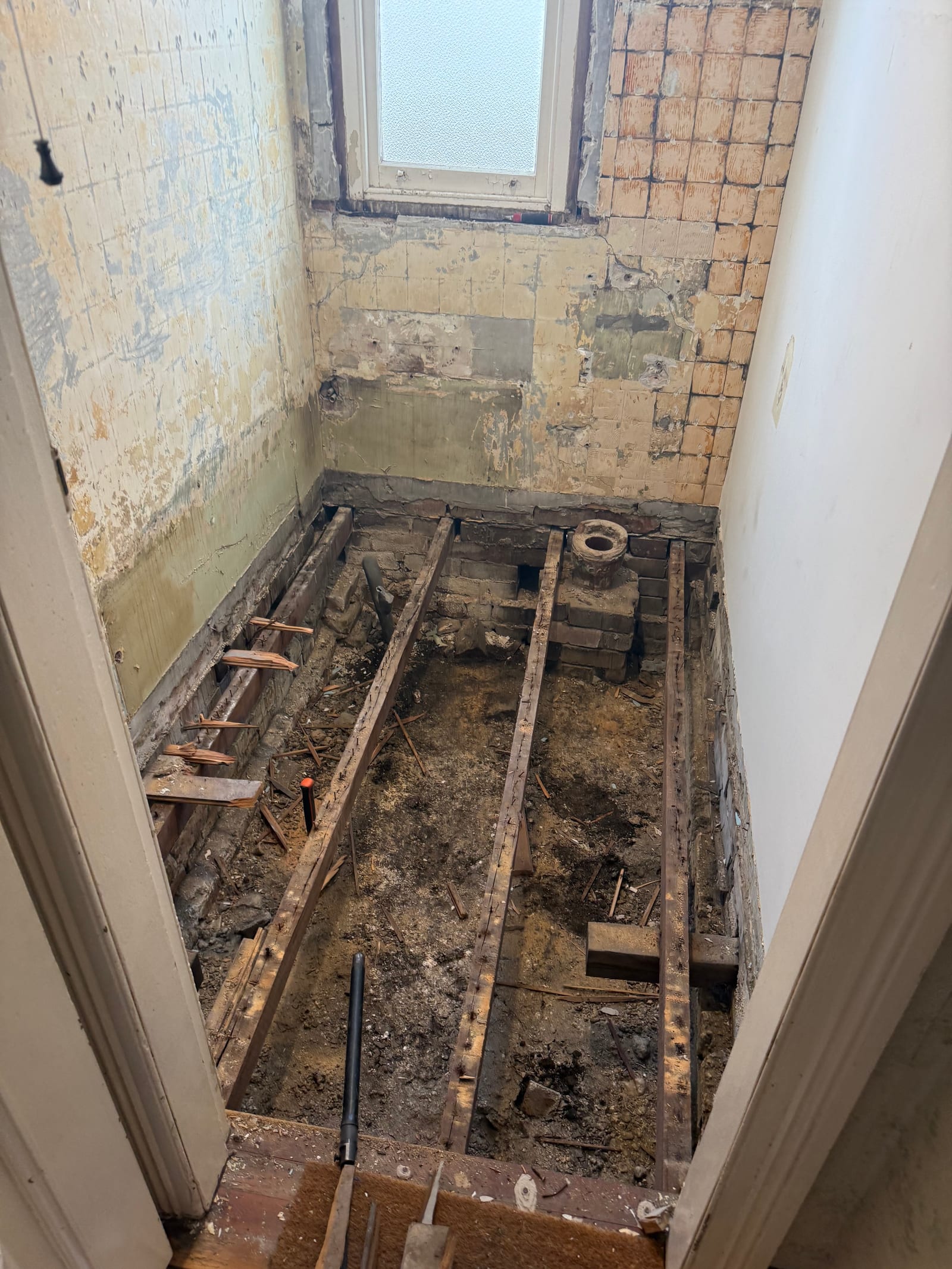 Heritage bathroom before renovation — full strip-out